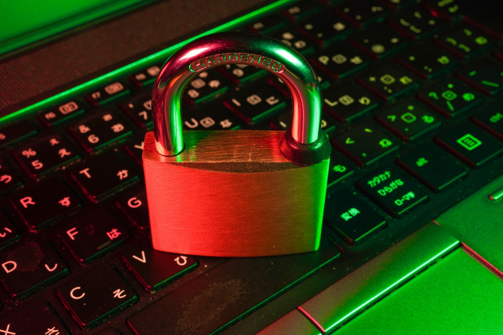 Padlock icon over a laptop keyboard, representing cybersecurity