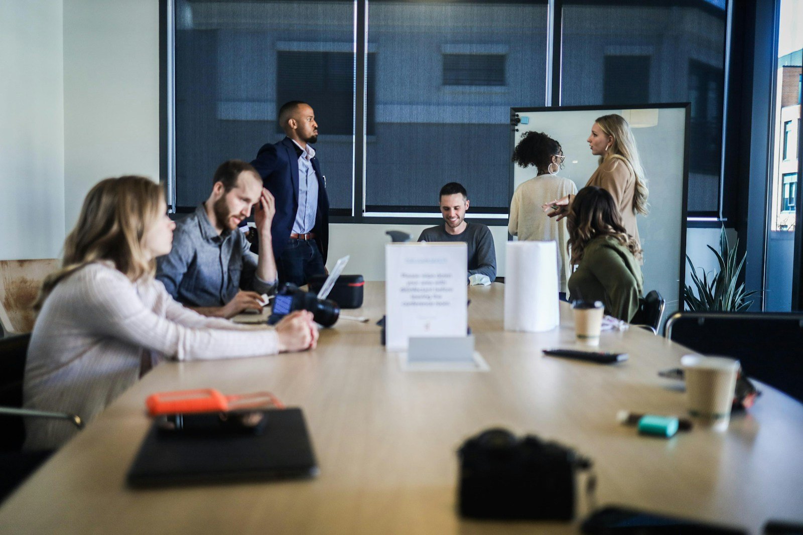 Marketing team reviewing performance charts on a monitor