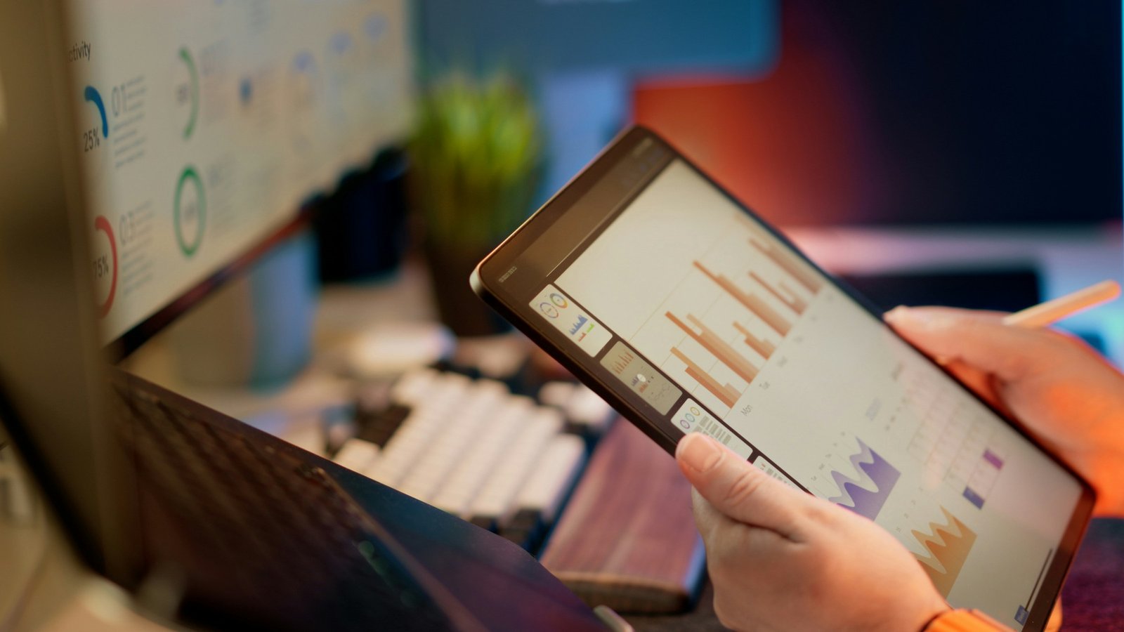 Business charts and analytics displayed on an office screen